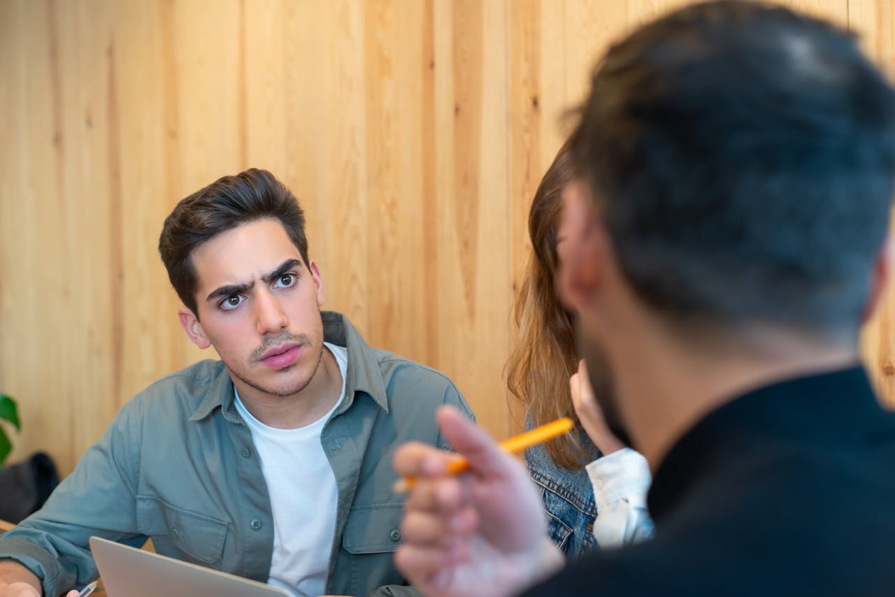 Business meeting with engaged team discussing ideas indoors.